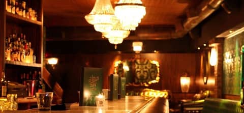 Old-World Speakeasy Bar with Fireplace