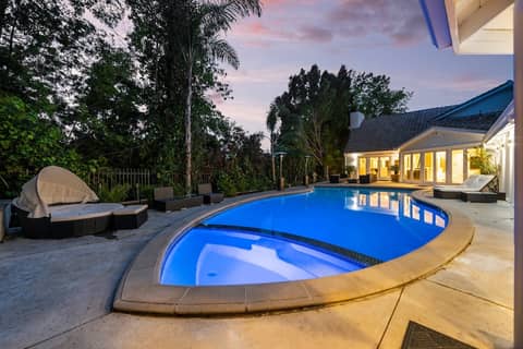 Gated White Estate with Pool and Lounge Patios